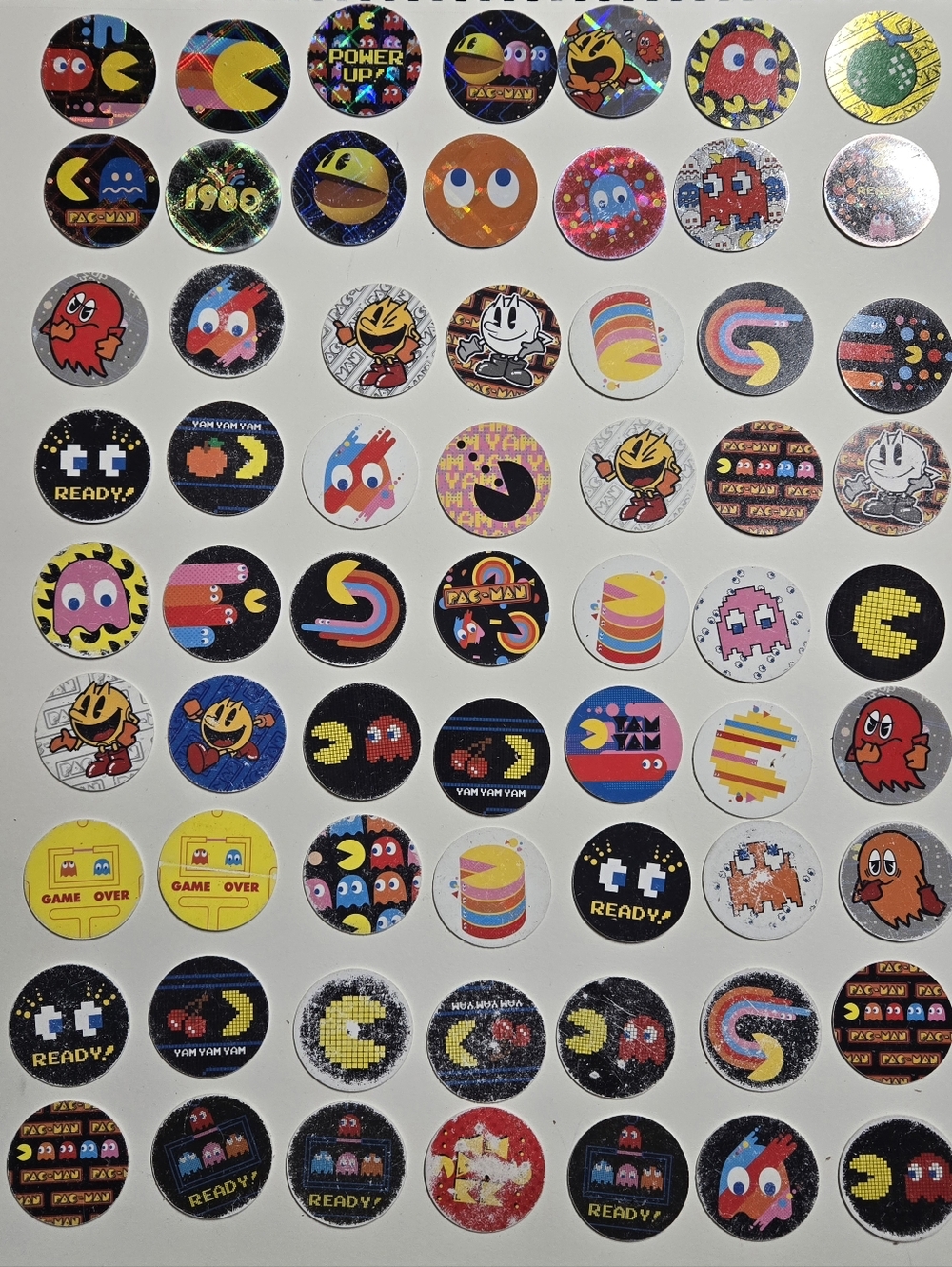 Lot of 63 vintage Pac Man Tazos pogs or caps good to poor condition (best condit